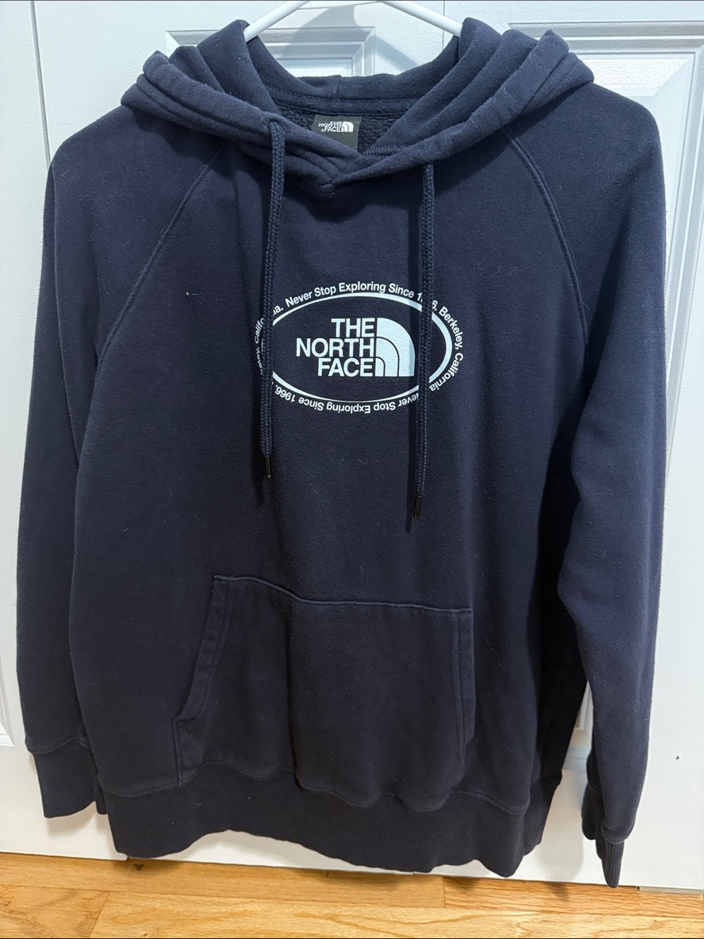 The North Face Navy Pullover Hoodie with White Logo
